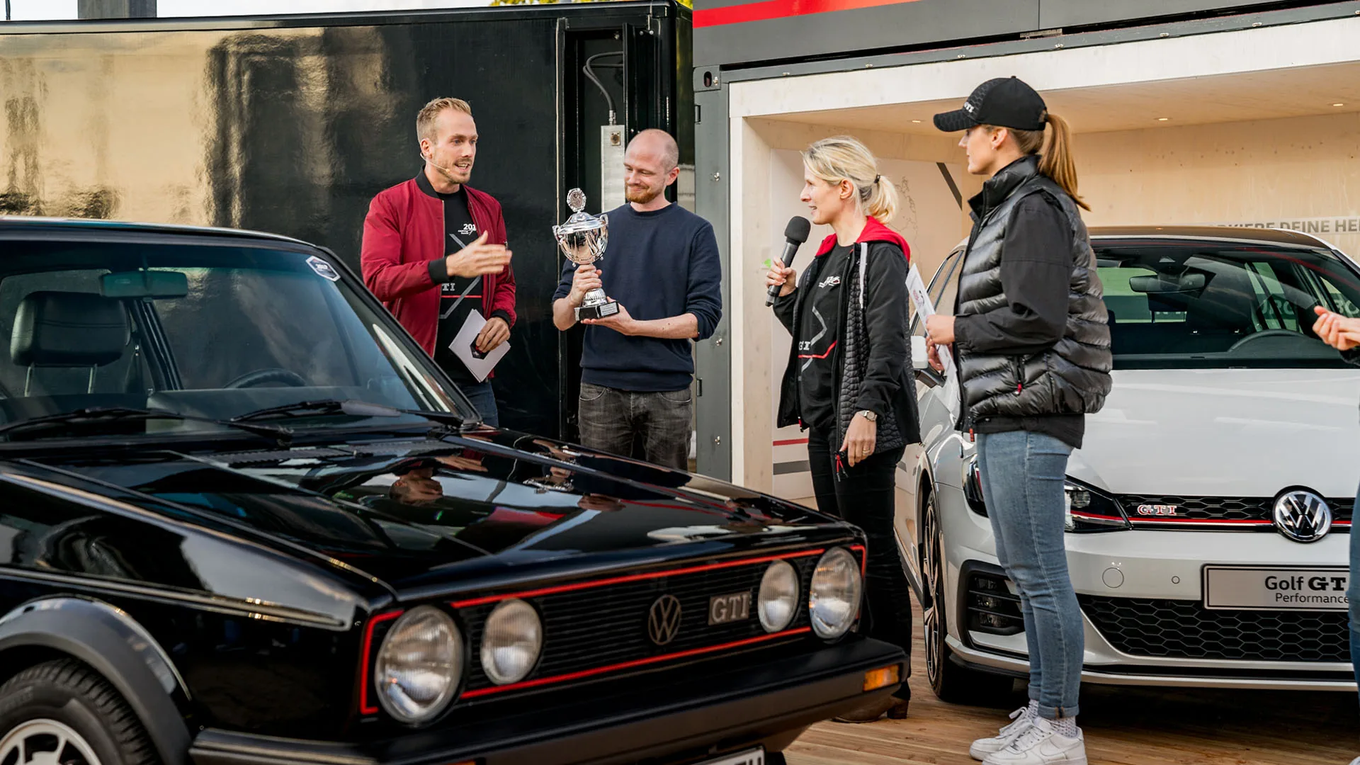 Event host Felix Uhlig conducting an interview at the Volkswagen GTI Coming Home awards in Wolfsburg